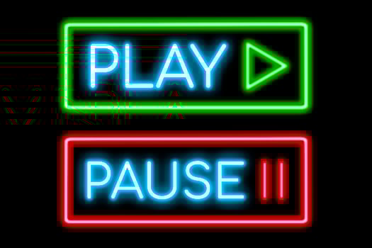 Play and Pause symbol neon banner, light signboard. photo