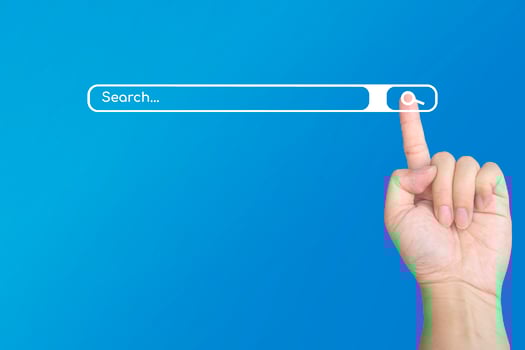 Hand with a finger touch on search symbol on the internet for searching the information data on blue background. photo