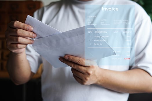 Man holding on an invoice note receipt financial. photo