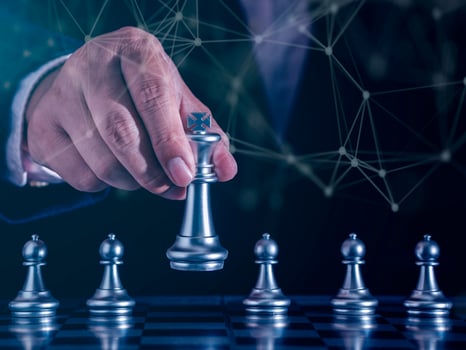 Hand of businessman moving gold king chess figure in competition success with double exposure digital graphic network line connecting diagram business.Strategy, leadership and management ideas concept photo