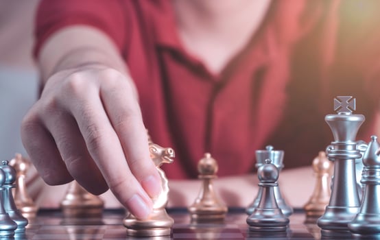 Hand of confident boy moving pawn chess to development in competition success play which new strategy plan, leader and teamwork, network learning tactics and analysis concept. photo