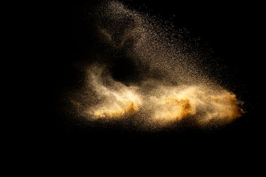Abstract cloud motion blurred sand background.Sandy explosion isolated on over dark background. photo