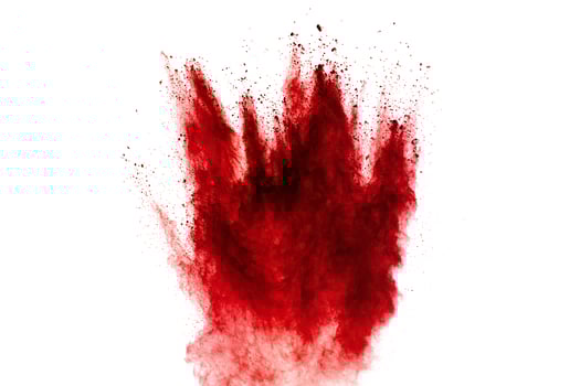 Red dust particles explosion on white background.Red sand splash. photo