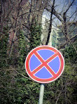 Red and blue regulation sign in the street. photo