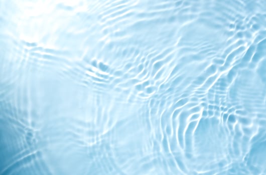 blurred transparent blue colored water surface photo