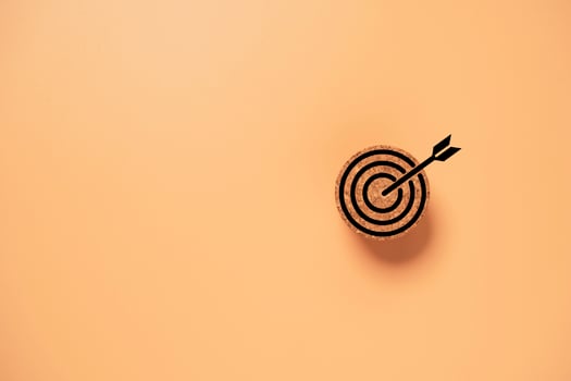 Target board on circle wooden block for setup objective target for business concept. photo
