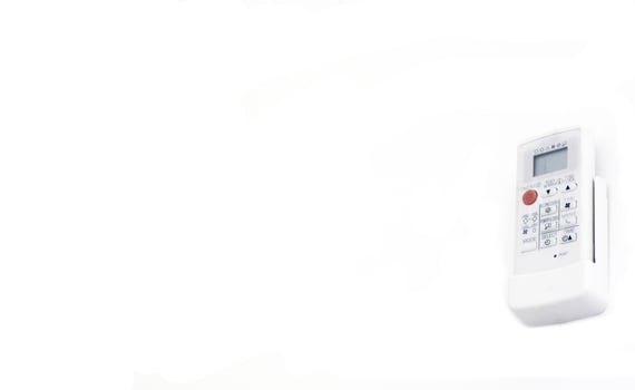Remote air condition on white background. photo