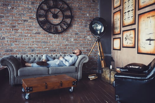 successful man in a suit resting photo