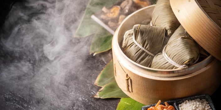 Zongzi, delicious fresh hot steamed rice dumplings in steamer. Close up, copy space, famous asian tasty food in dragon boat duanwu festival photo