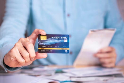 Businessman payment bill receipt with credit card , business e-commerce to pay credit card debt concept photo