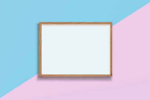 Horizontal empty wooden frame on pink and blue pastel background , blank frame mock up with copy space, photo