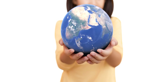 Hand hold plant on earth on white isolated background for ecology environment concept. photo