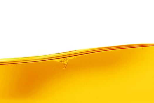 Wave of oil viscosity and air bubbles inside oil isolated on white background. photo