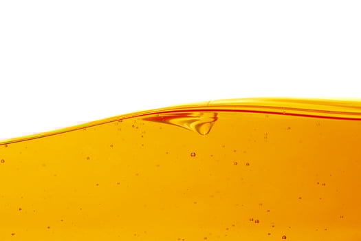 Wave of oil viscosity and air bubbles inside oil isolated on white background. photo