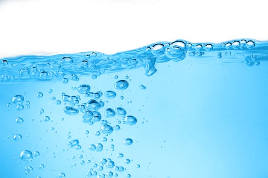 Blue surface water and air bubble isolated on white background photo