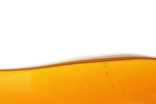 Wave of oil viscosity and air bubbles inside oil isolated on white background. photo