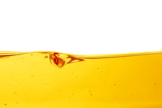 Wave of oil viscosity and air bubbles inside oil isolated on white background. photo