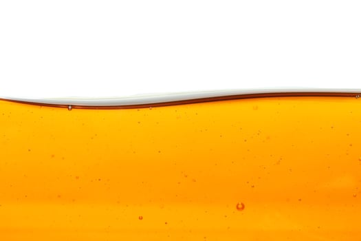 Wave of oil viscosity and air bubbles inside oil isolated on white background. photo