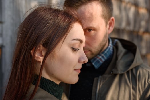 Young fashion couple posing on the street in sunny fall . Creamy autumn sunlight. photo
