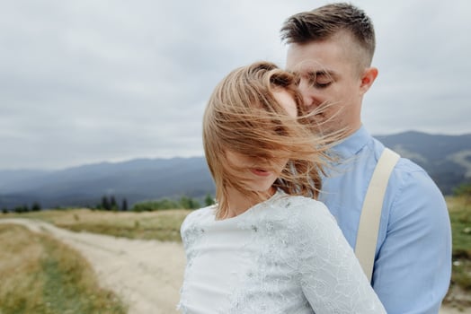 Photoshoot of the bride and groom in the mountains. Boho style wedding photo. photo