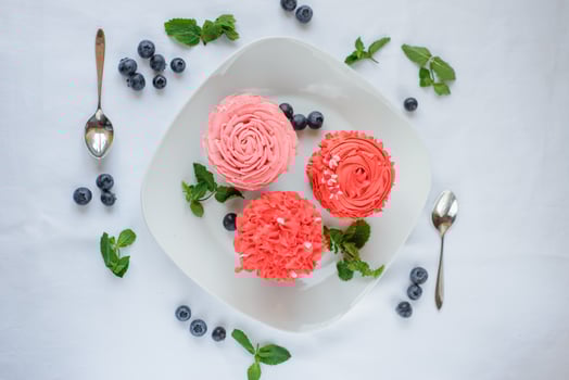 Delicious cupcake on a white plate on a white background. photo