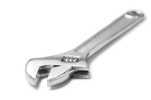 Adjustable spanner isolated on white photo