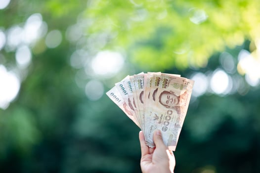 Hand and money, multiple banknotes of financial executives For business and daily spending photo