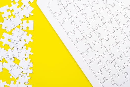 A jigsaw puzzle on a yellow background Business idea photo