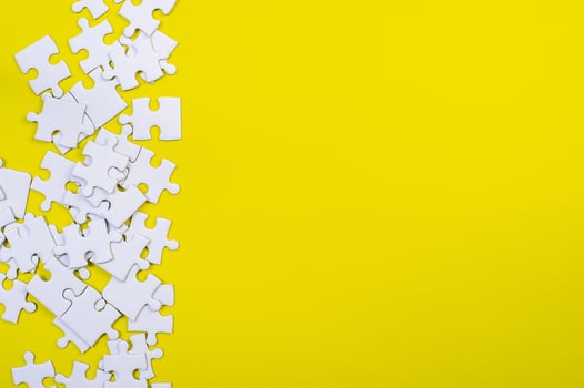 Jigsaw puzzles on the yellow background photo