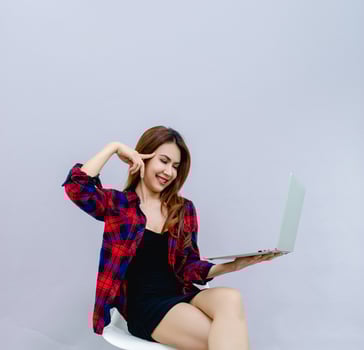 Women and laptops Sit happily at work The concept of running a smooth business. photo