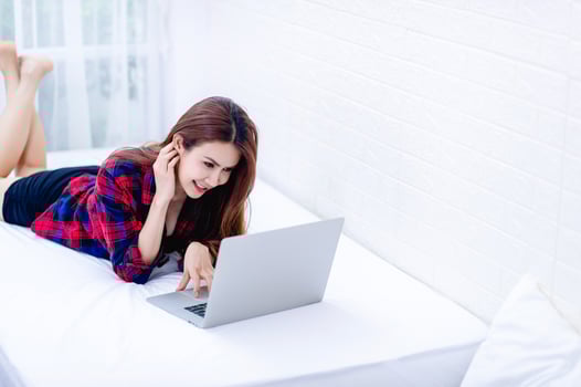 The woman and the computer in the white room Happy work The concept of happy working at home photo