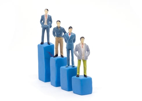 Miniature businessman and graph on white background, Business Growth concept photo