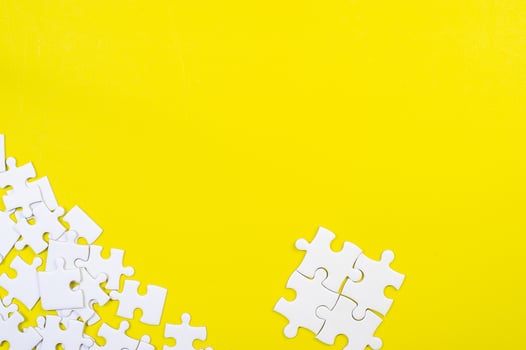 Jigsaw puzzles on the yellow background photo