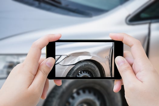 woman using mobile smartphone take photo car crash accident