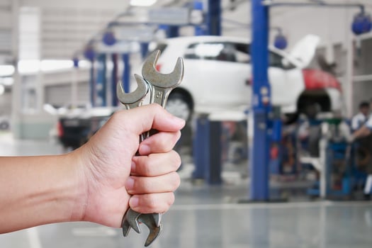 Hand of professional Auto mechanic with wrench photo