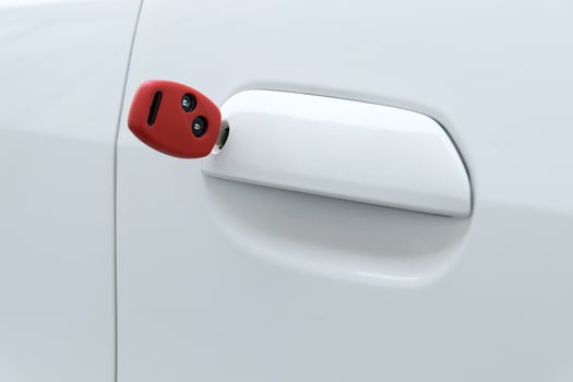 open car door with red key photo