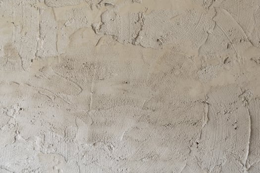 Closeup fragment of stucco wall of a building photo