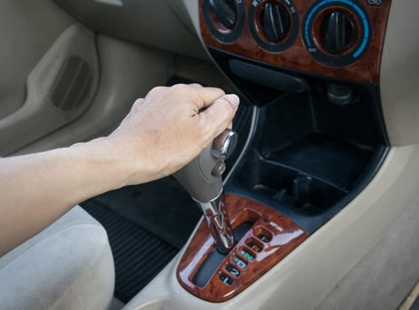 hand on automatic gear shift photo