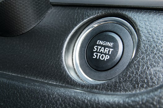 Engine start stop button from a modern car interior photo