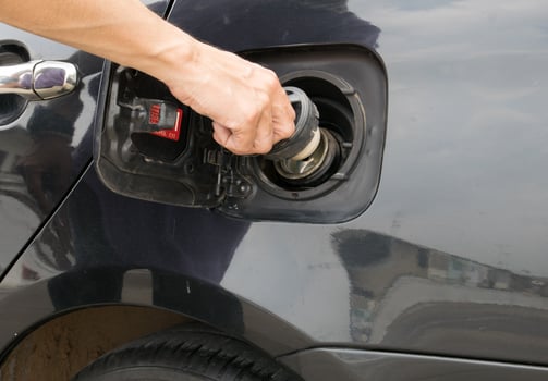 Hand opening the oil filler cap photo
