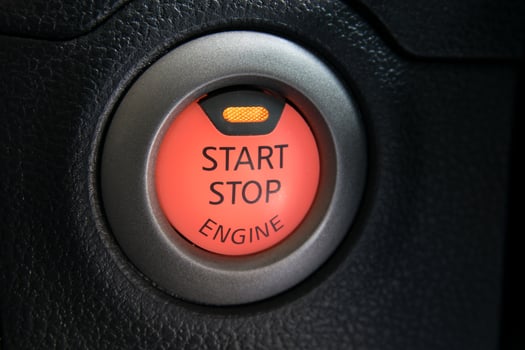 Engine start stop button from a modern car interior photo