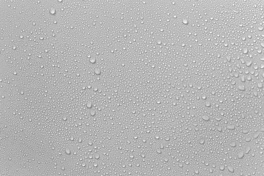 The concept of raindrops falling on a gray background Abstract wet white surface with bubbles on the surface Realistic pure water droplet water drops for creative banner design photo