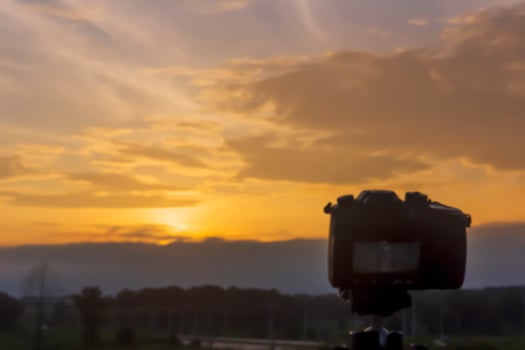 The concept of blur, the camera is taking pictures of the scenery of Twilight, sky, sunset, beautiful colors on the background. photo