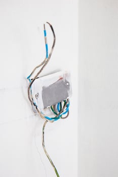 unfinished power socket on the wall photo