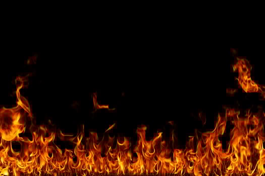 Fire flames on black background. photo