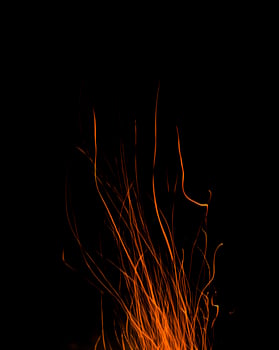 fire flames with sparks on a black background photo
