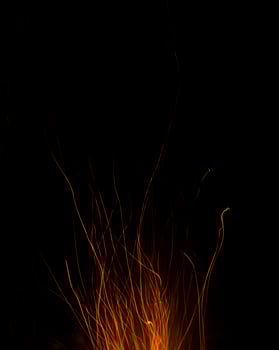 fire flames with sparks on a black background photo