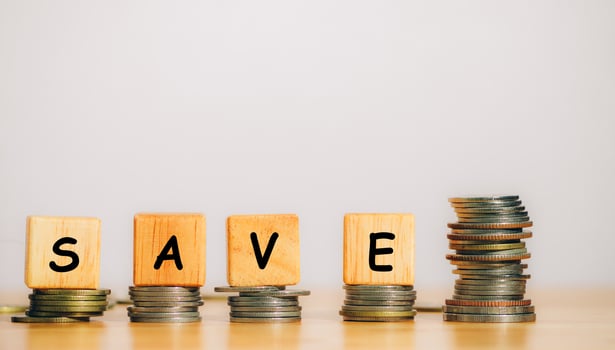 The word SAVE is written from a wooden block or cube to save money invest for future. Concept for loan, property ladder, financial, real estate investment, taxes and bonus. photo