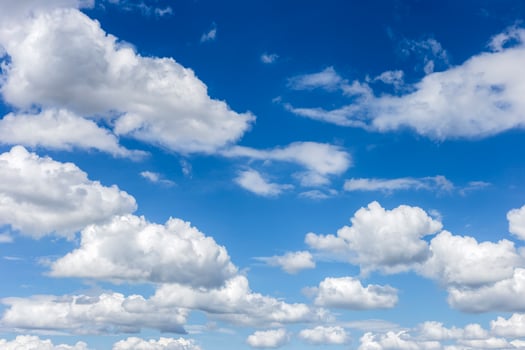 clear blue sky with plain white cloud with space for text background. The vast blue sky and clouds. blue sky background with tiny clouds nature. photo