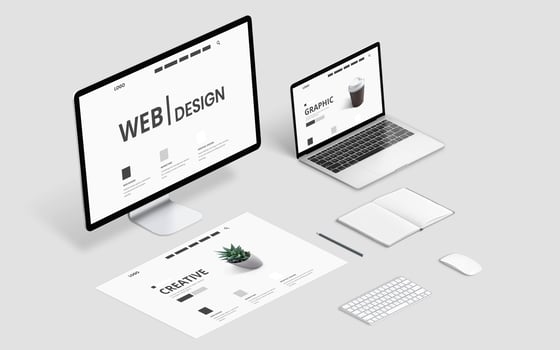 Isometric web design studio desk with computer display, laptop and concept page layout photo